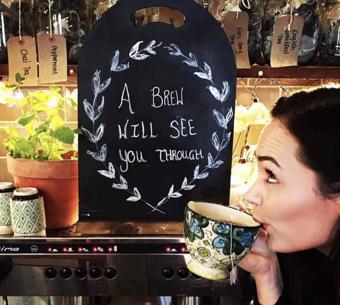 Expert barista at The Yard Café carefully preparing artisan coffee using specialty beans